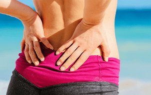 Біль в куприку у жінок: причини, симптоми, лікування